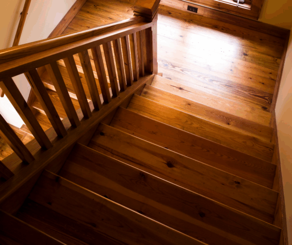 Top view of a wooden staircase with a polished finish